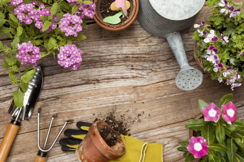 Gardener preparing tools and safety equipment before outdoor work