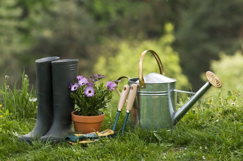 Professional gardener working carefully in a maintained garden