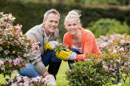Gardening staff wearing PPE during maintenance work